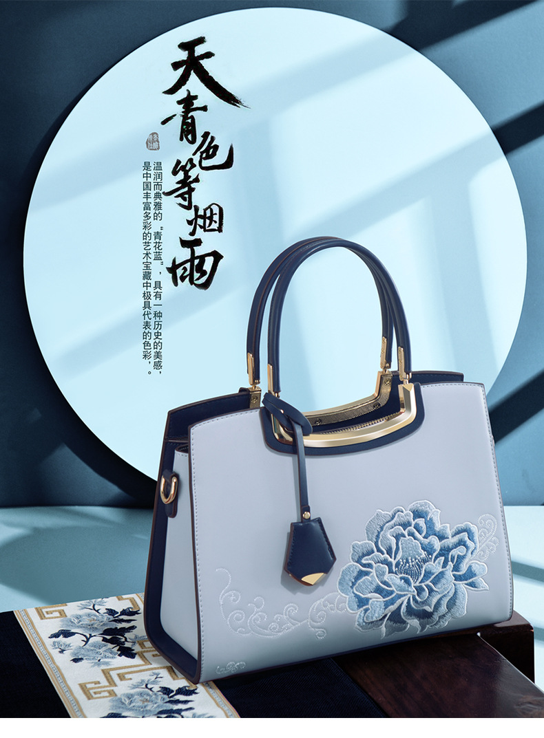 Ladies Elegant Burgundy Handbag with Floral Embroidery And Gold-Tone Hardware